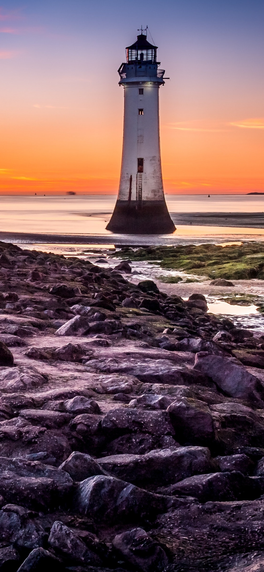 Lighthouse 4K Wallpaper, Beach, Rocky coast, Sunset, Blue