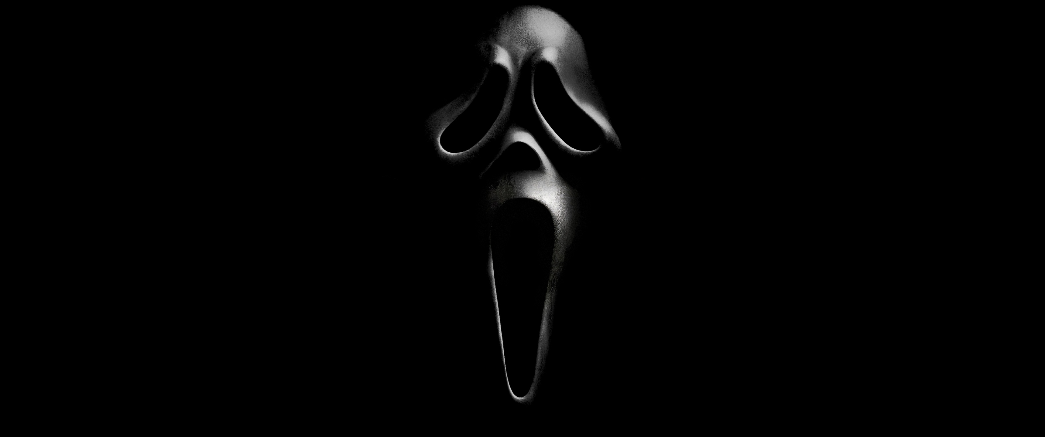 Hình nền đen kinh dị Scream 4K với Ghostface có sẵn để tải về, đem lại cảm giác rùng rợn cho màn hình của bạn. Thiết kế rất phù hợp để áp dụng vào trang trí cho Halloween hoặc thưởng thức các bộ phim kinh dị.