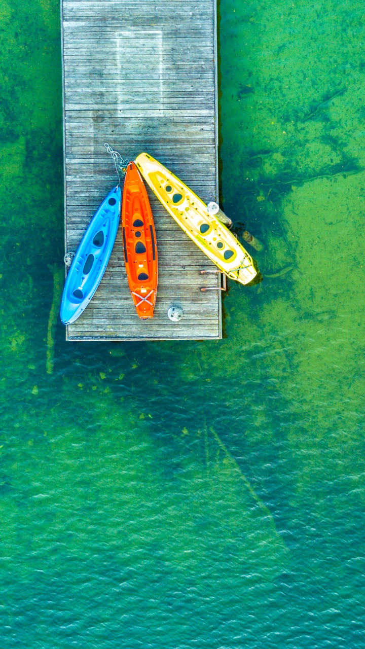 wooden pier 4k wallpaper, aerial view, kayak boats, lake
