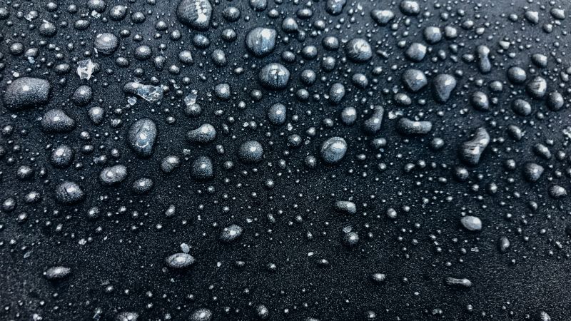 Droplets frozen tarmac rain drops monochrome bubbles 