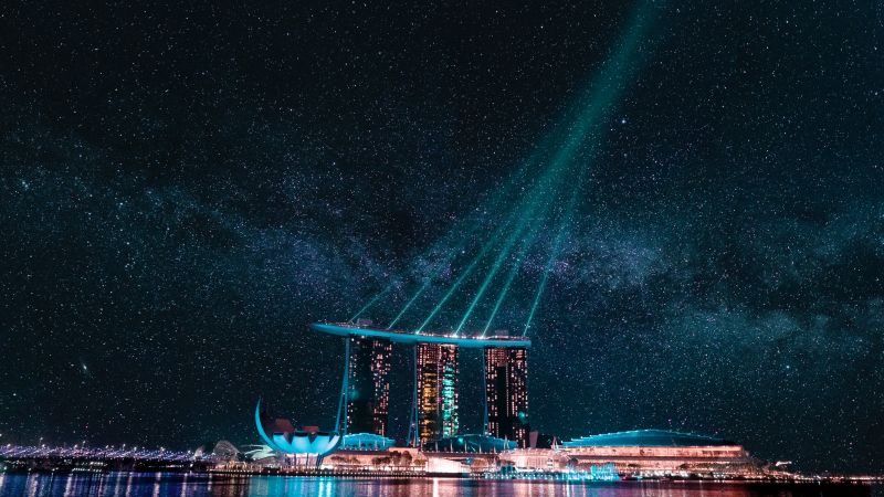 Marina Bay Sands, Hotel, Singapore, Stars, Night life, City lights, Body of Water, Reflection, Light beam, Modern architecture, Laser Lights, Astronomy, Cityscape, 5K, Wallpaper