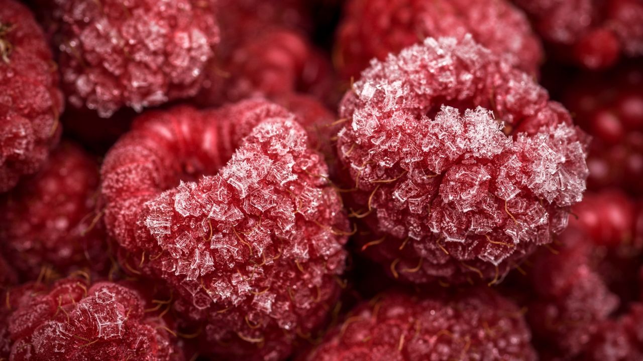 frozen raspberries red fruits closeup macro