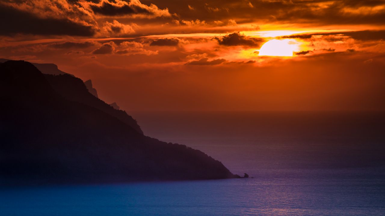 mallorca island spain sunset orange cloudy sky ocean dusk