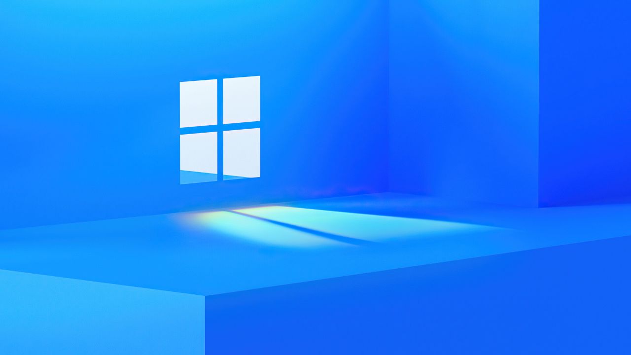 A picture that has a blue wallpaper with the Windows 11 logo.