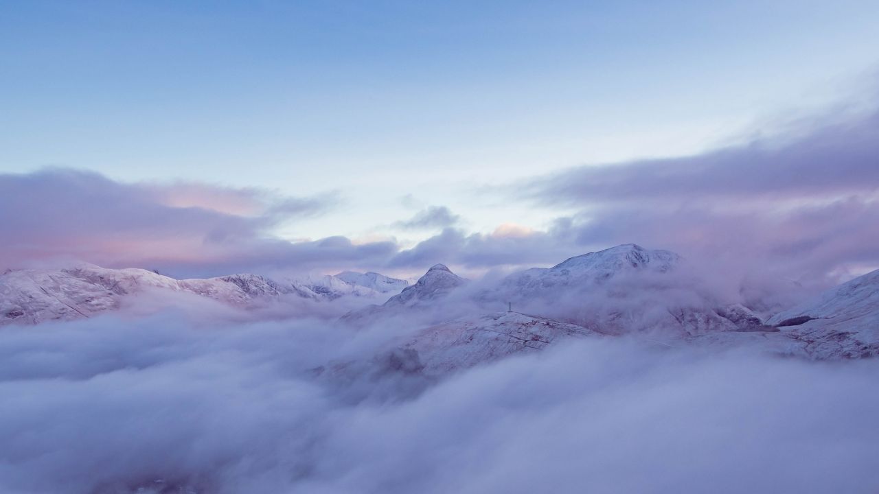 mountain range glacier mountains early morning foggy snow