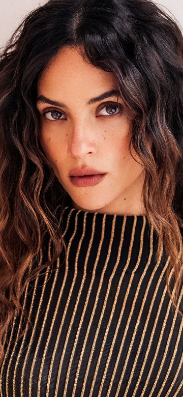 Adria Arjona background