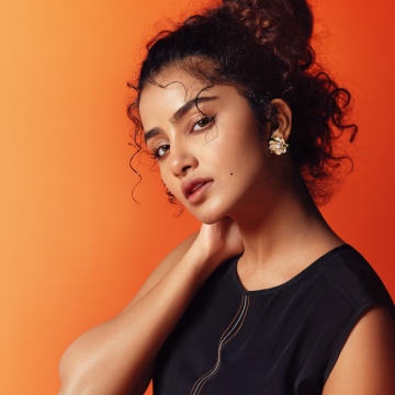 Anupama Parameswaran, 8K, Orange background, Indian actress, 5K