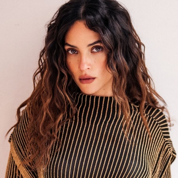 Adria Arjona background