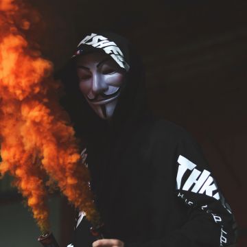 Guy Fawkes mask, Man in Mask, Black Hoodie, Orange Smoke, Dark background, Anonymous, 5K