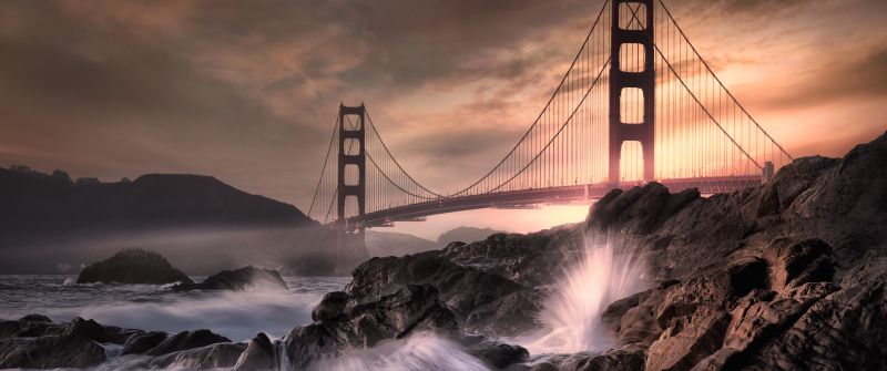 Golden Gate Bridge, California, Rocky coast, Water splash, Long exposure, Metal structure, Cloudy, Landmark, Dusk, Sunset