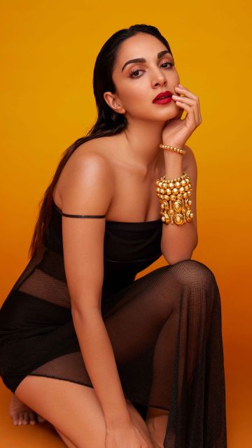 Kiara Advani, Black dress, Orange background, 5K, Indian actress