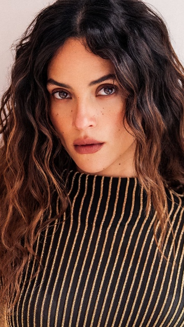 Adria Arjona background
