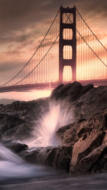 Golden Gate Bridge, California, Rocky coast, Water splash, Long exposure, Metal structure, Cloudy, Landmark, Dusk, Sunset